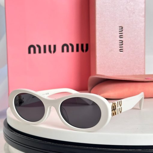 MIU MIU. Decorated with the MIU MIU logo. Acetate frame. Oval-shaped. Women's sunglasses. In black. - Image 2